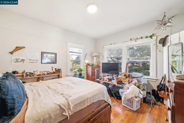 a kitchen with stainless steel appliances granite countertop a stove a sink dishwasher and cabinets with wooden floor