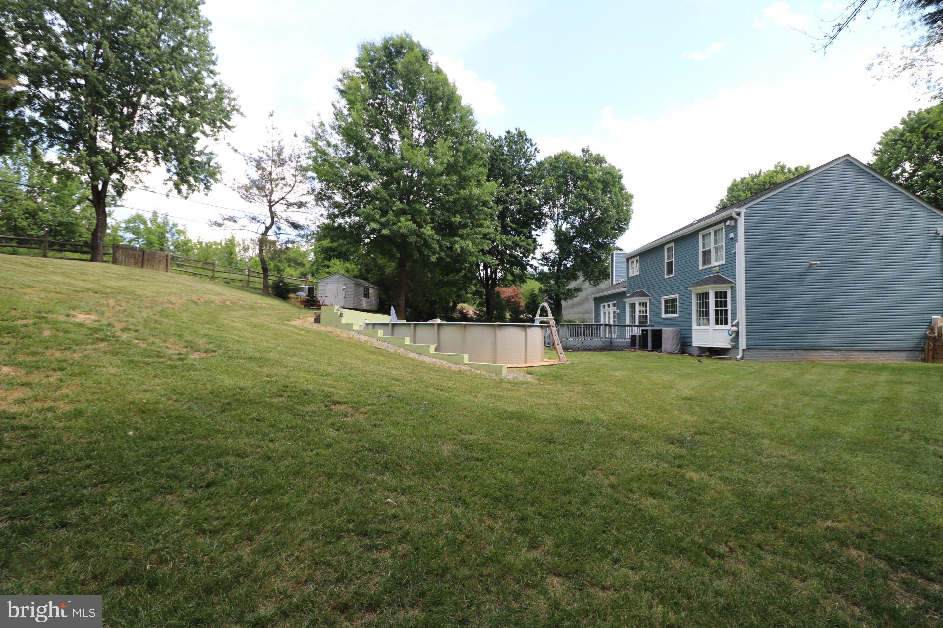 11901 Rustic Farm Court Germantown, MD 20874 - Photo 122 of 134 Spacious backyard with lush greenery.