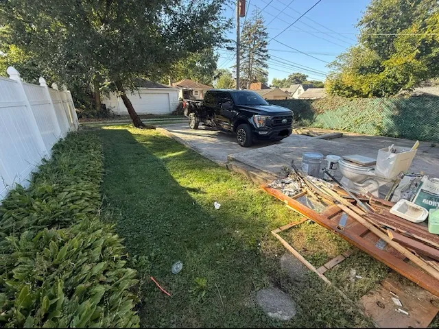 a view of a backyard with sitting area