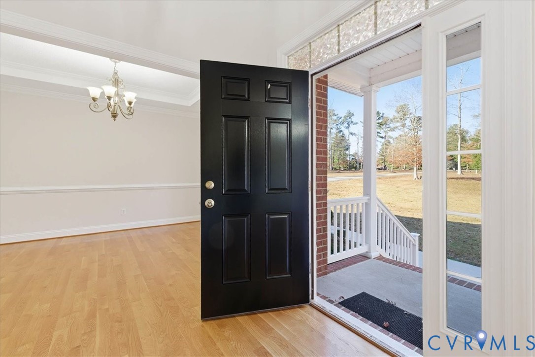 11891 Old Stage Road Prince George, VA 23875 - Photo 5 of 38 Entryway featuring open space and cathedral ceilin