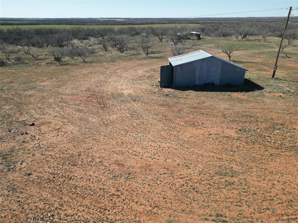444 Merkel Tx 79536 Merkel, TX 79536 - Photo 4 of 32 a view of a dry yard with wooden fence