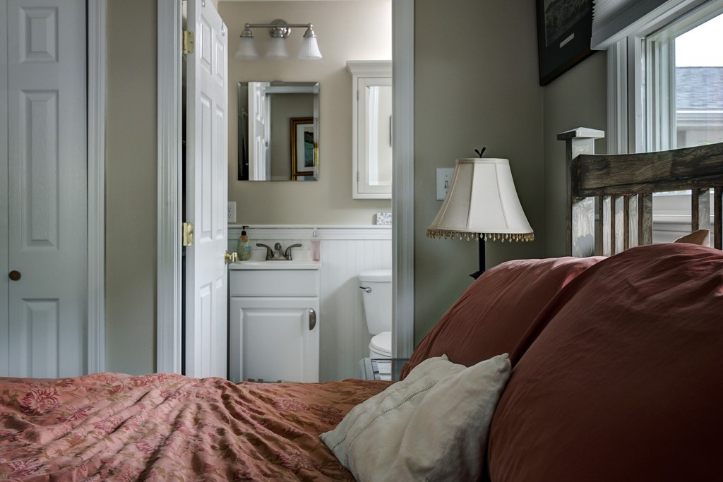 12 Amy Road Framingham, MA 01701 - Photo 16 of 30 a bedroom with a bed and a lamp on dresser