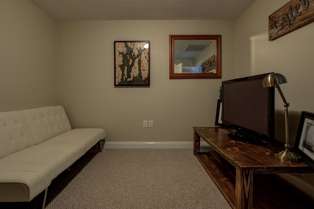 12 Amy Road Framingham, MA 01701 - Photo 18 of 30 a living room with furniture and a flat screen tv