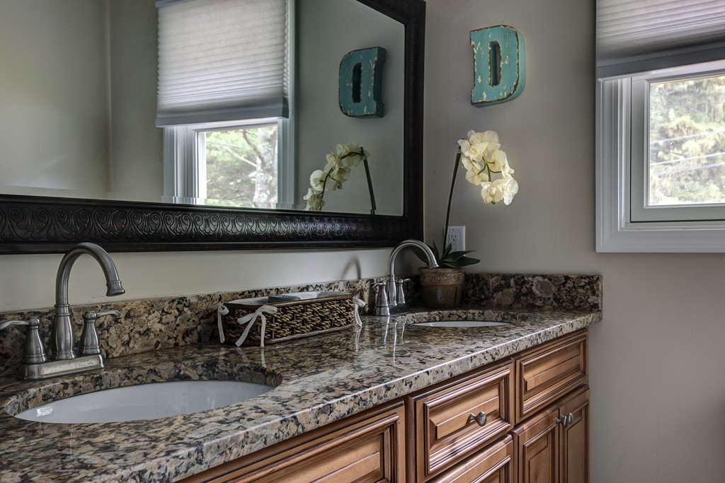 12 Amy Road Framingham, MA 01701 - Photo 22 of 30 a bathroom with sink and mirror