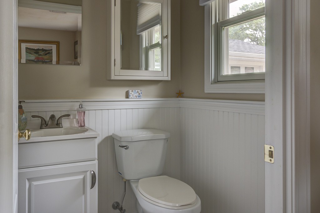 12 Amy Road Framingham, MA 01701 - Photo 23 of 30 a bathroom with a toilet sink vanity and mirror