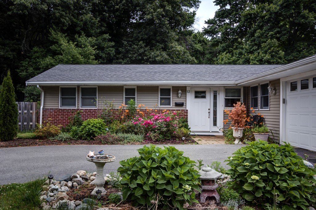12 Amy Road Framingham, MA 01701 - Photo 24 of 30 a front view of a house with yard and outdoor seating