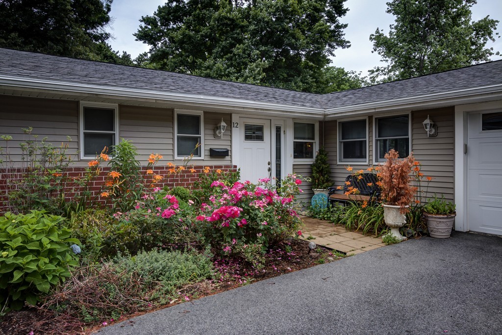 12 Amy Road Framingham, MA 01701 - Photo 25 of 30 a view of a house with sitting area and garden