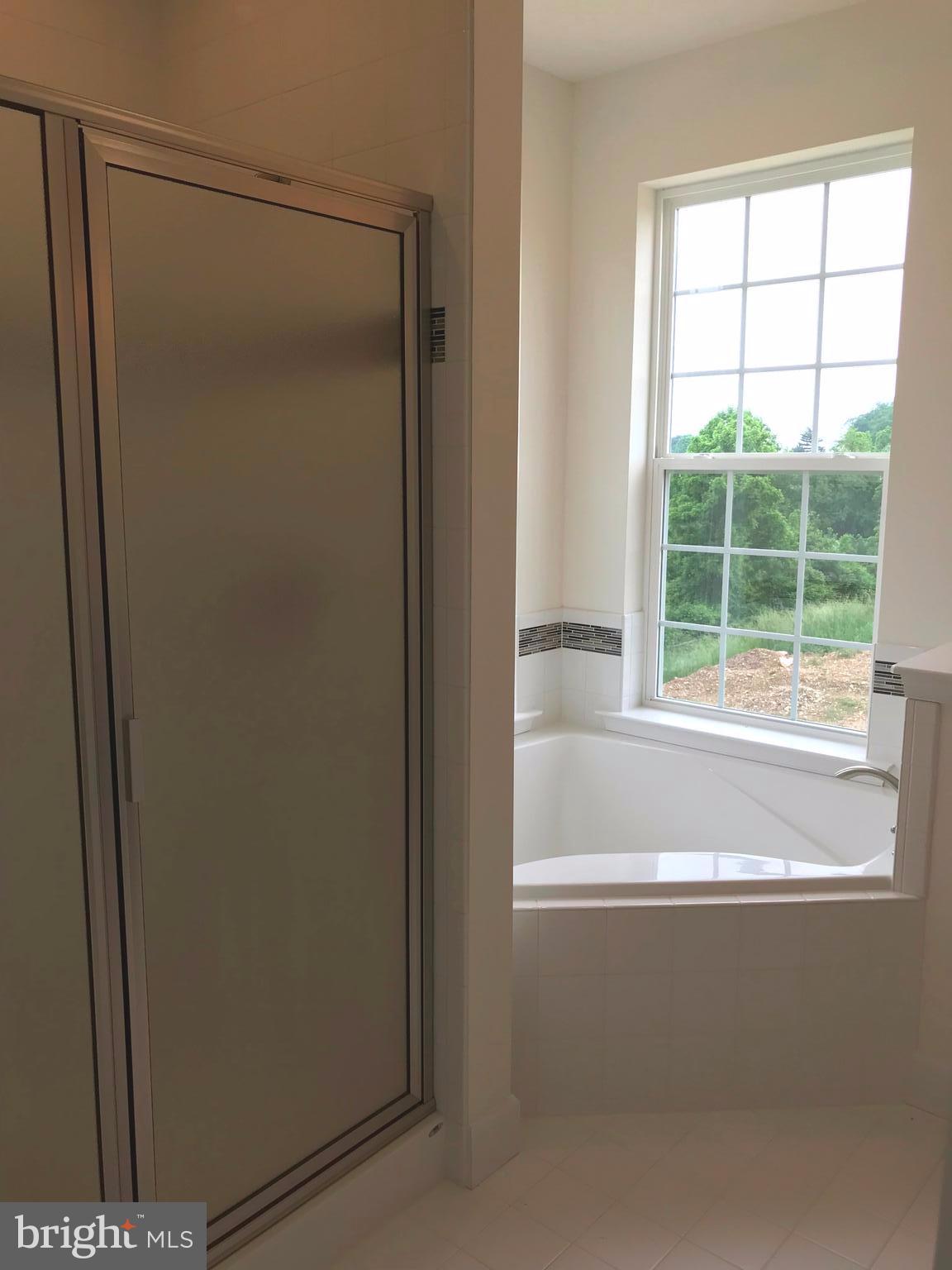 860 Ripple Drive, Unit 76 Hanover, PA 17331 - Photo 5 of 16 Master Bath- Tiled soaker tub, shower and floors
