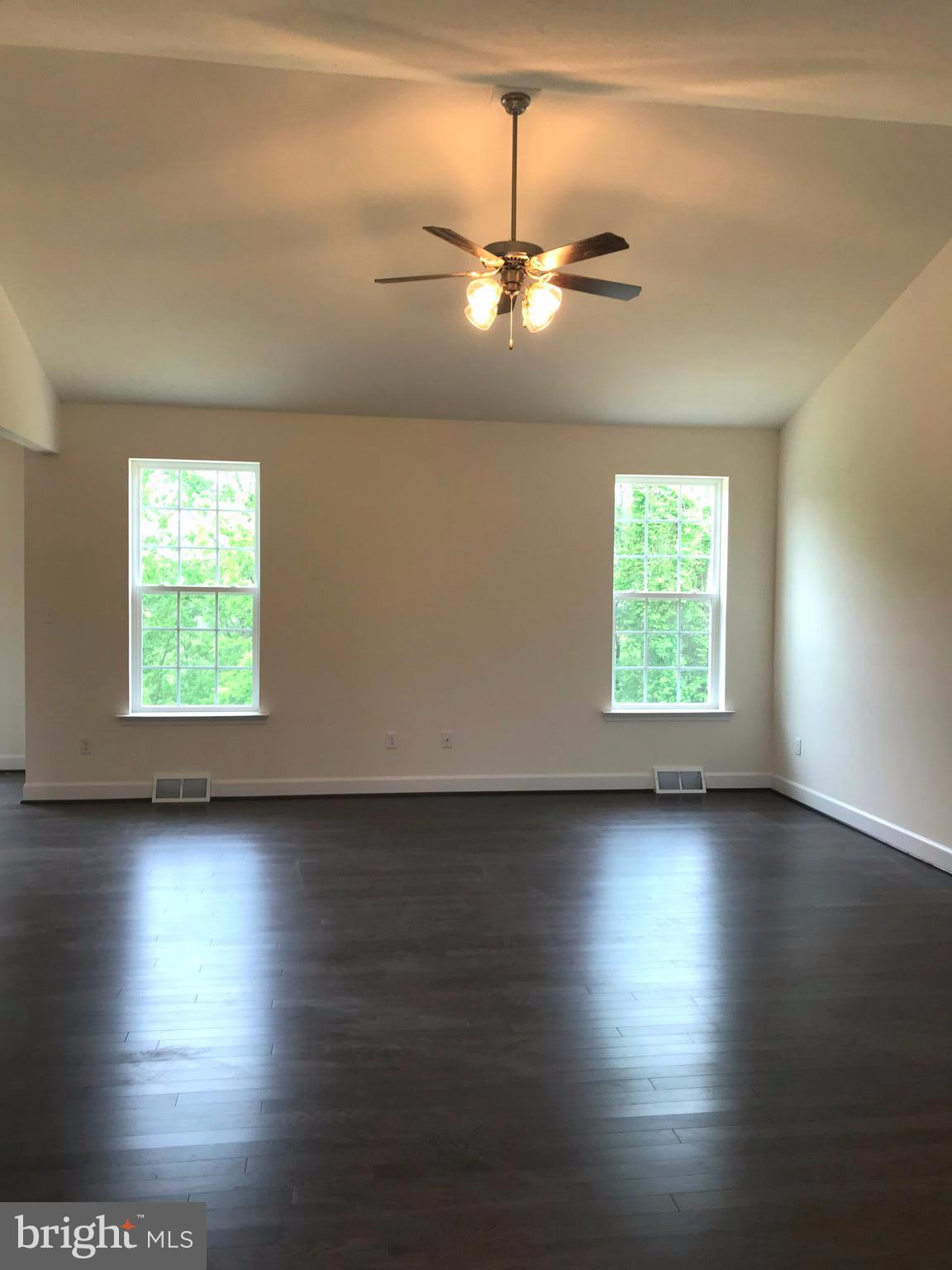 860 Ripple Drive, Unit 76 Hanover, PA 17331 - Photo 8 of 16 Family room- hardwood floors, cathedral ceiling