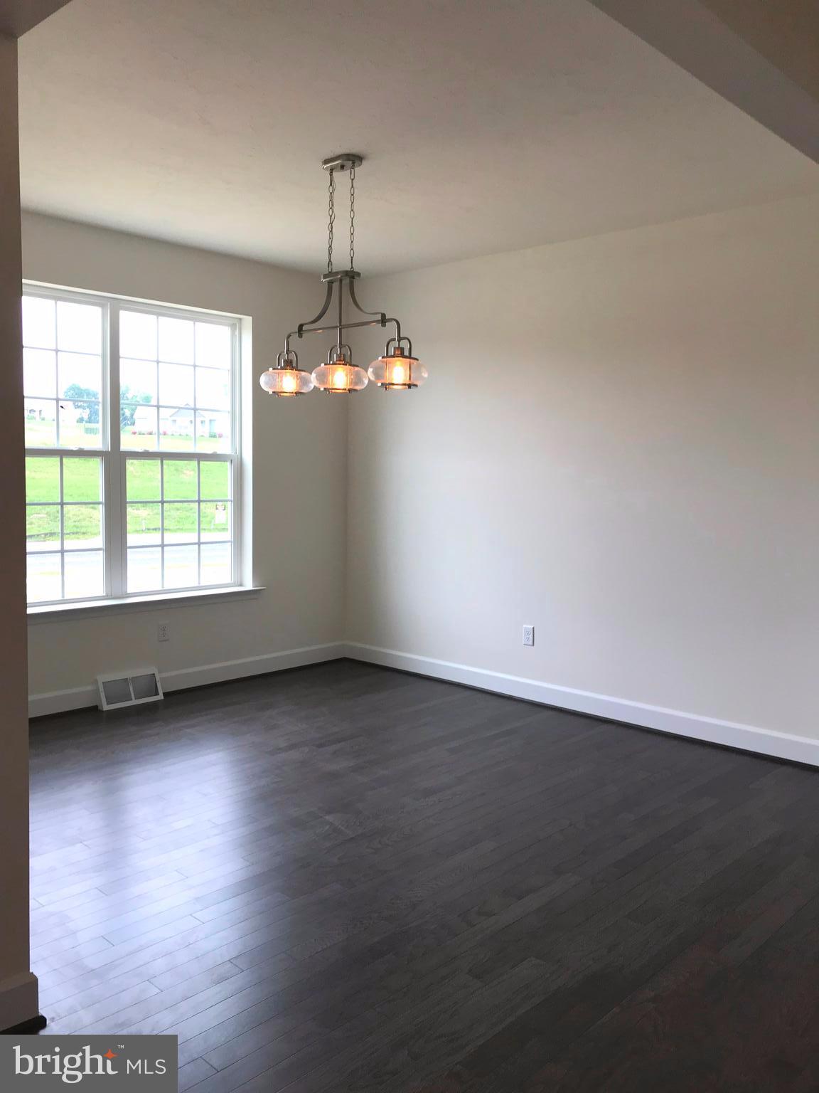 860 Ripple Drive, Unit 76 Hanover, PA 17331 - Photo 9 of 16 Dining room- hardwood floors and upgraded lighting