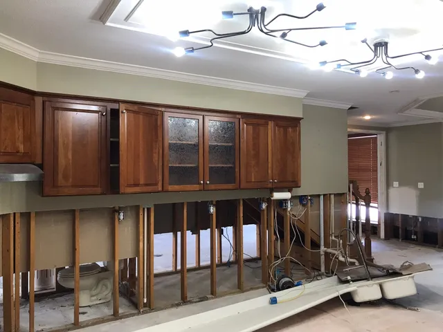 a view of a livingroom with a window and brick walls