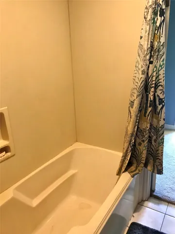 a view of a swimming pool and trees in the background