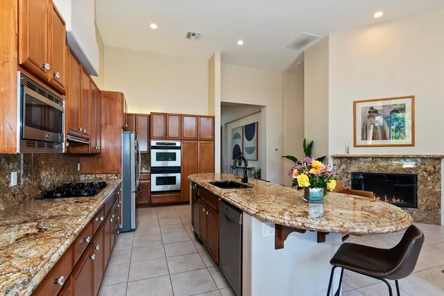 a kitchen with a dining table and chairs