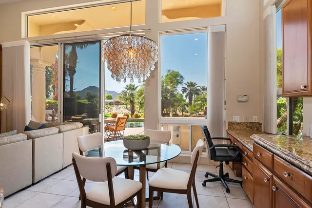 a view of a dining room with furniture window and outside view