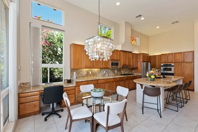 a living room with furniture kitchen view and a fireplace