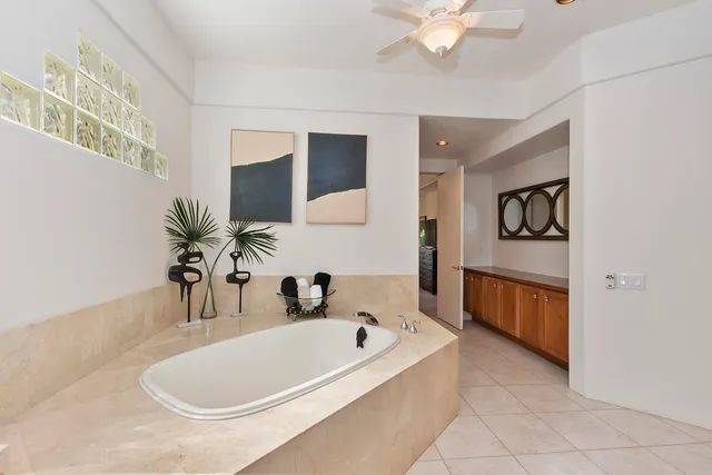 a bedroom with a bed and a television