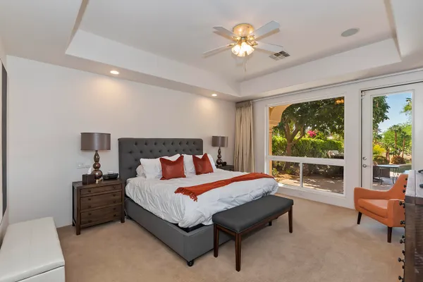 a large bathroom with a double vanity sink a large mirror and a shower