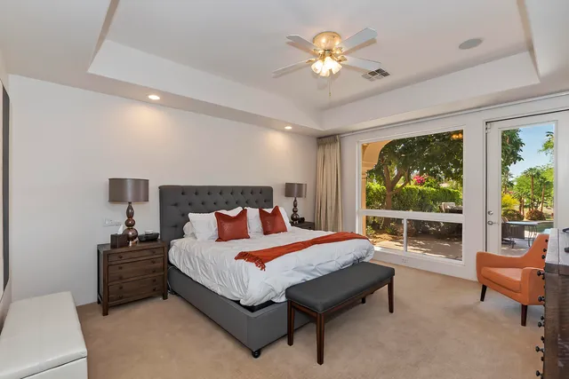 a large bathroom with a double vanity sink a large mirror and a shower