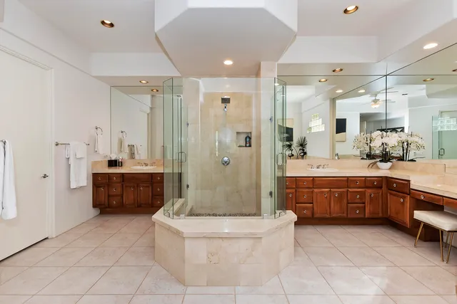 a front view of a house with a garden and yard