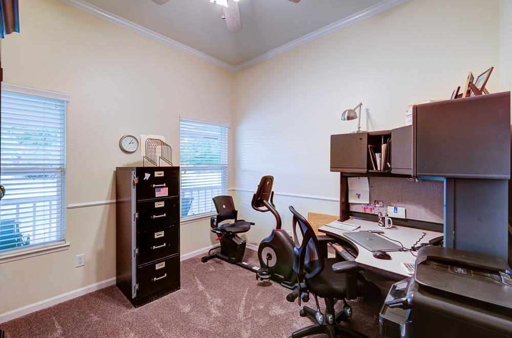 17465 Monreal Road Madera, CA 93636 - Photo 40 of 59 a view of a workspace with furniture