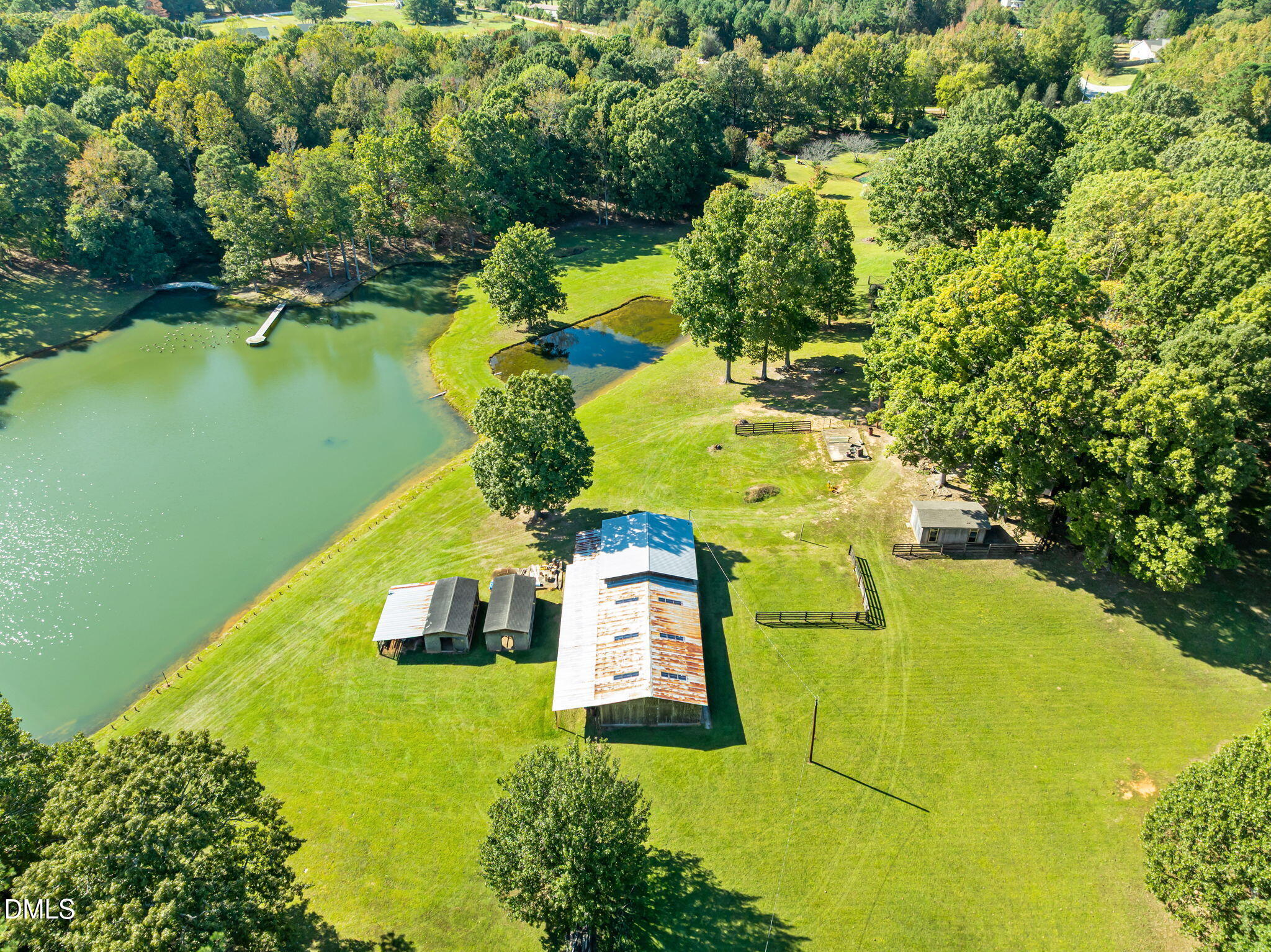 917 John Mitchell Road Youngsville, NC 27596 - Photo 15 of 16 a view of a swimming pool with a yard