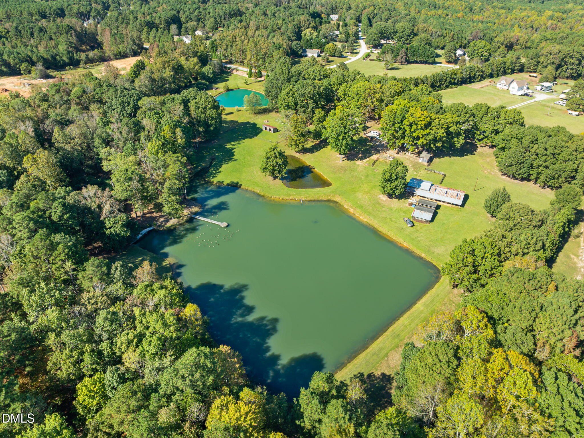 917 John Mitchell Road Youngsville, NC 27596 - Photo 10 of 16 an aerial view of a house with a yard