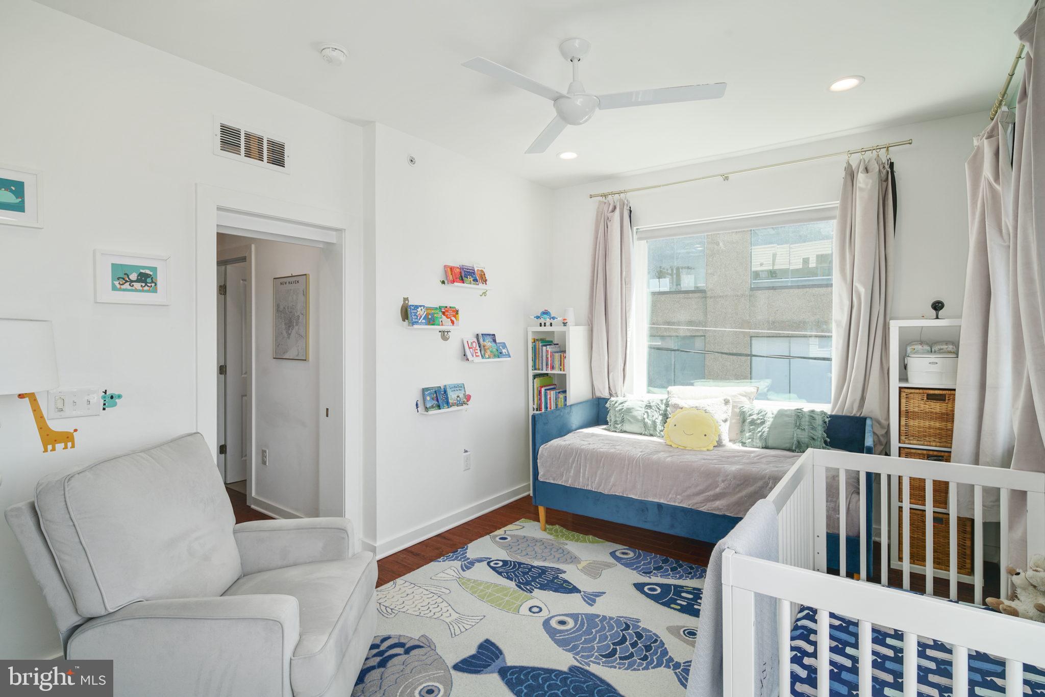 159 East Allen Street, Unit 1 Philadelphia, PA 19125 - Photo 32 of 45 a bedroom with furniture and a window