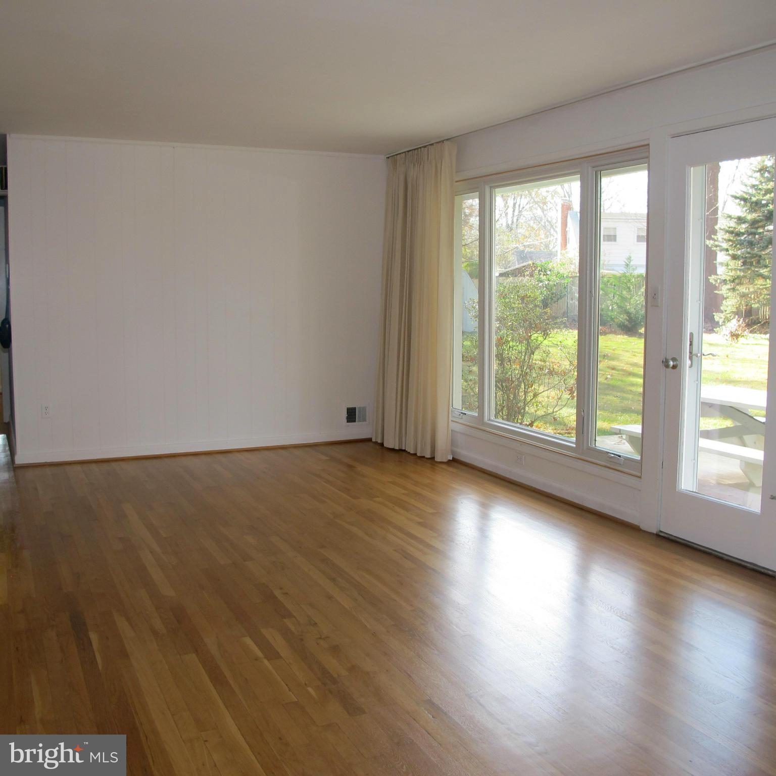 305 Cavalier Court Silver Spring, MD 20901 - Photo 5 of 30 Living Room with view of rear Gardens