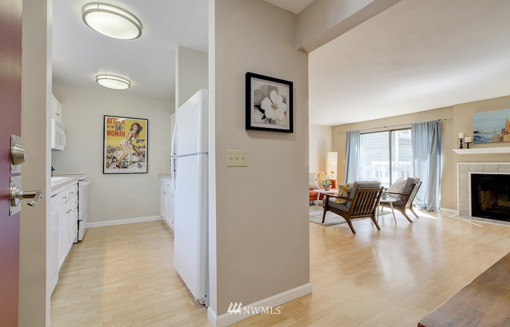 555 Prospect Street, Unit 3 Seattle, WA 98109 - Photo 2 of 23 a dining room with furniture and a fireplace