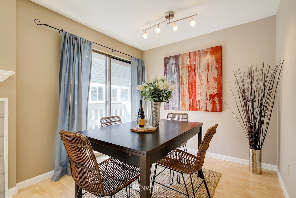 555 Prospect Street, Unit 3 Seattle, WA 98109 - Photo 5 of 23 a dining room with furniture window and wooden floor