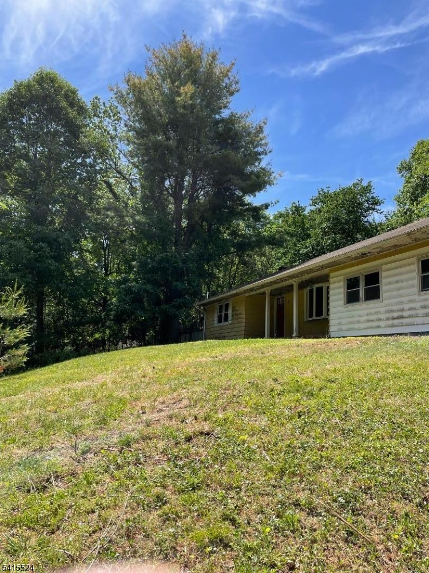 150 Karrville Road Port Murray, NJ 07865 - Photo 1 of 40 a backyard of a house with lots of green space