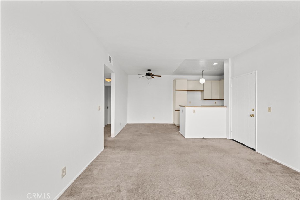 27645 Susan Beth Way, Unit A Saugus, CA 91350 - Photo 5 of 26 a view of a kitchen with a refrigerator