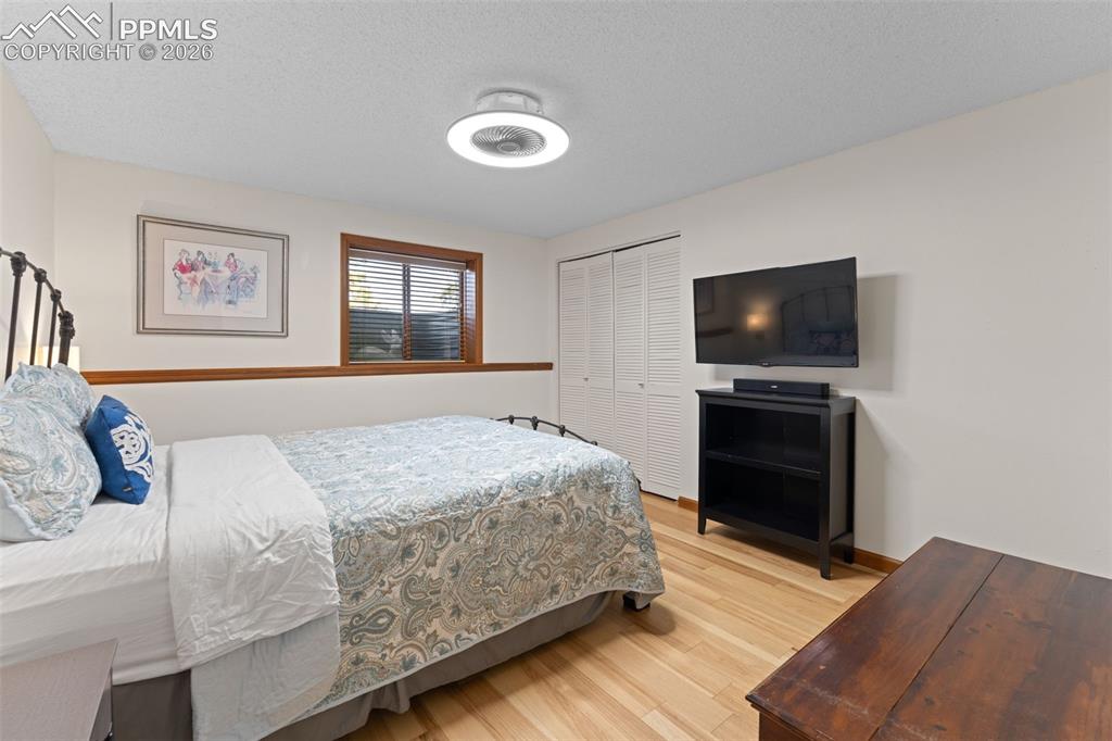 1851 Buttercup Road Elizabeth, CO 80107 - Photo 32 of 47 a bedroom with a bed and a flat screen tv
