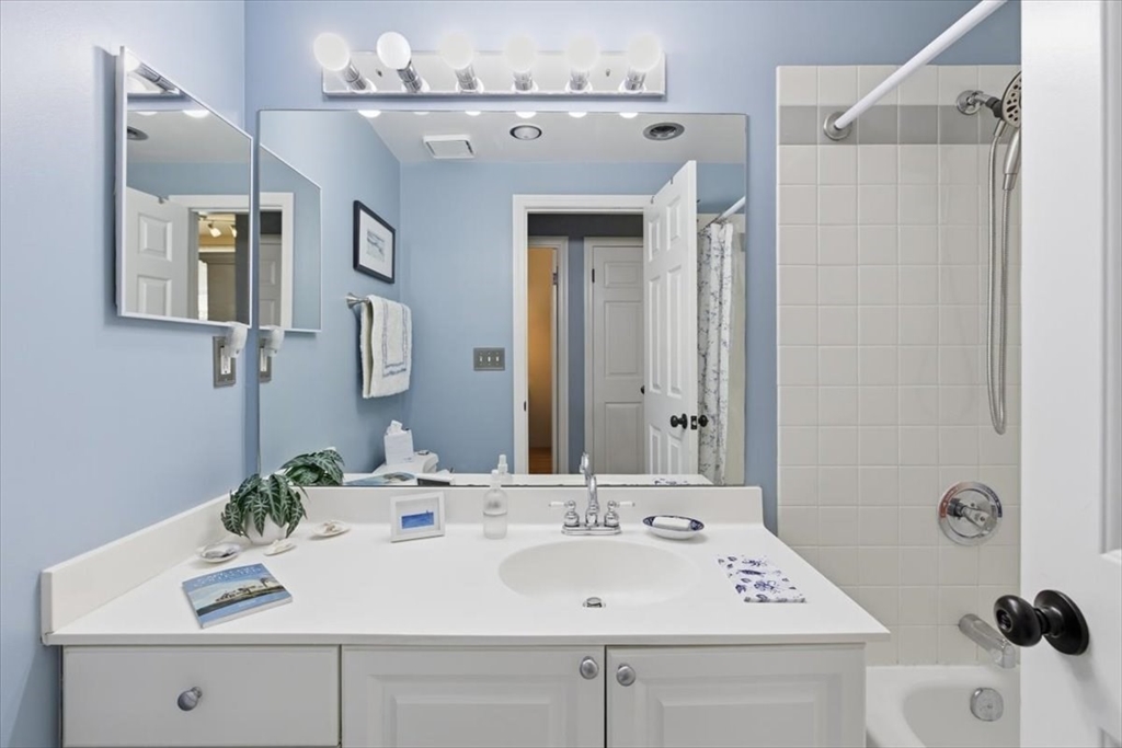 65 Glen Road, Unit H1 Brookline, MA 02445 - Photo 31 of 39 a bathroom with a sink and a mirror