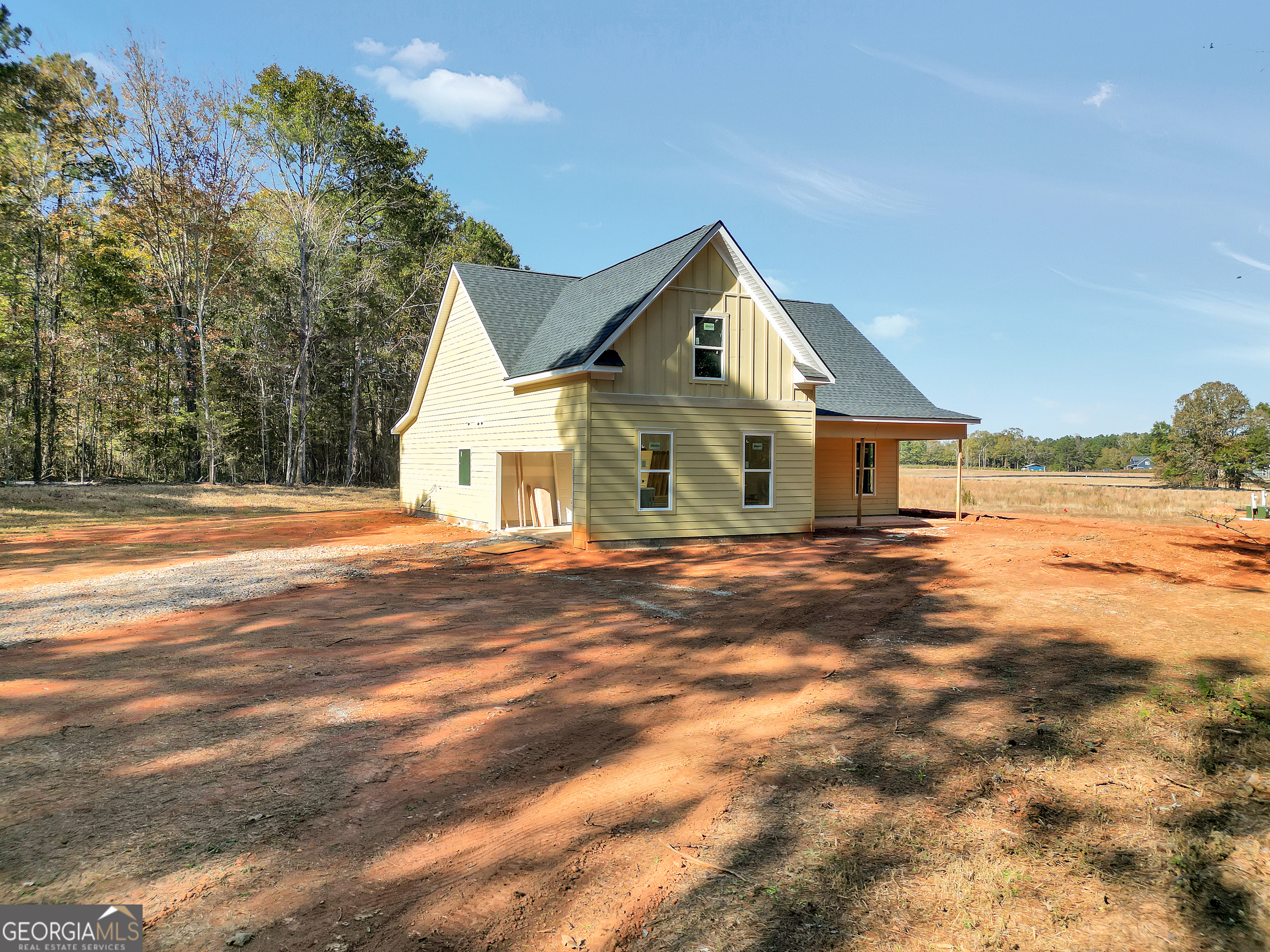 51 Oak Road Locust Grove, GA 30248 - Photo 3 of 8 a front view of a house with a garden