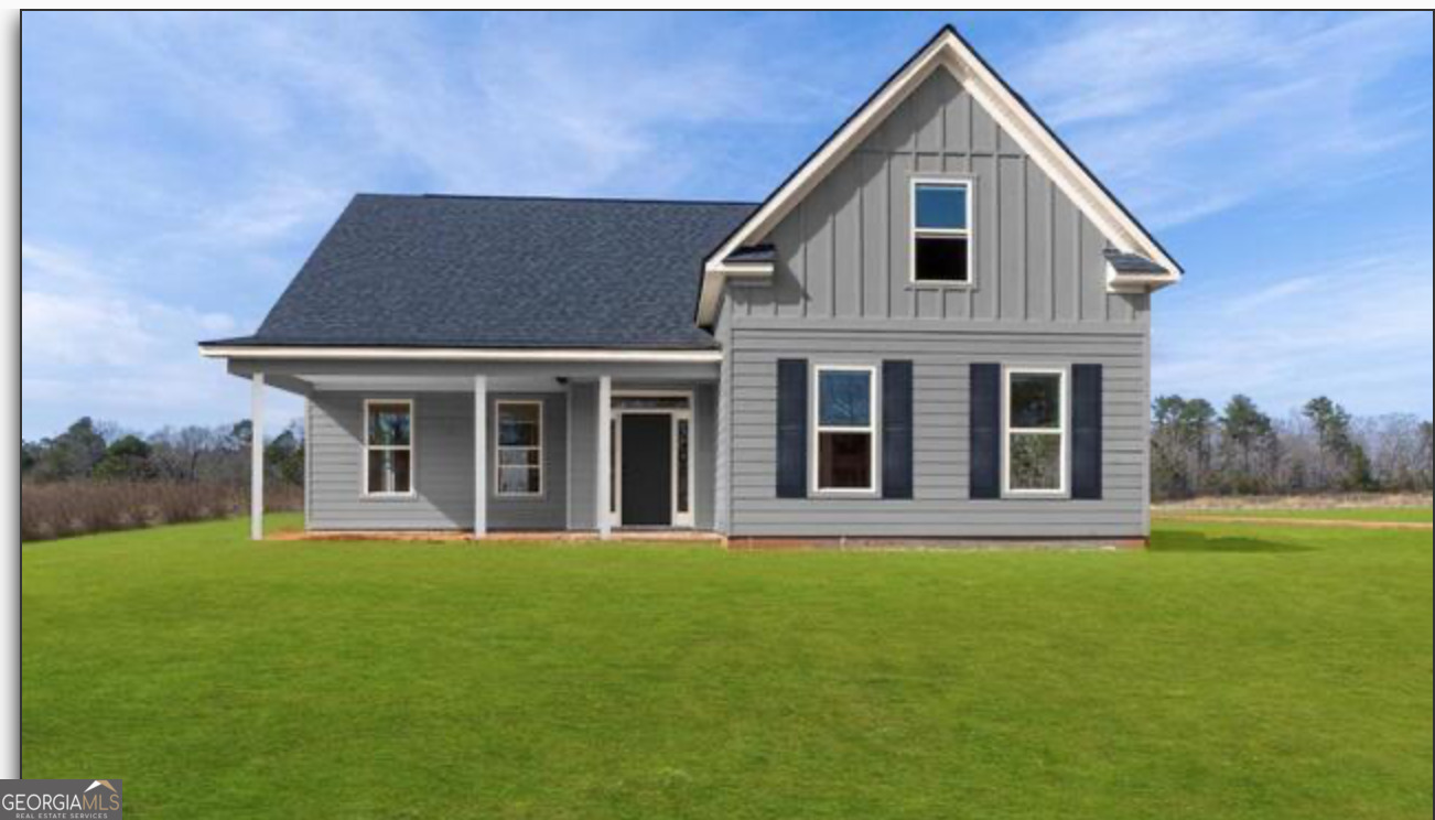 51 Oak Road Locust Grove, GA 30248 - Photo 4 of 8 a front view of a house with a yard