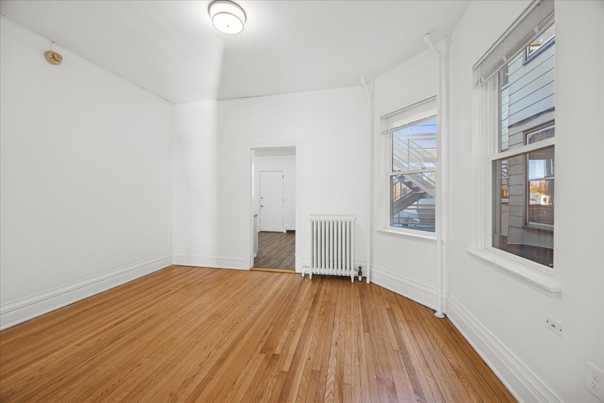 3 East Quincy Street, Unit 2 Riverside, IL 60546 - Photo 13 of 21 a view of a room with wooden floor and windows