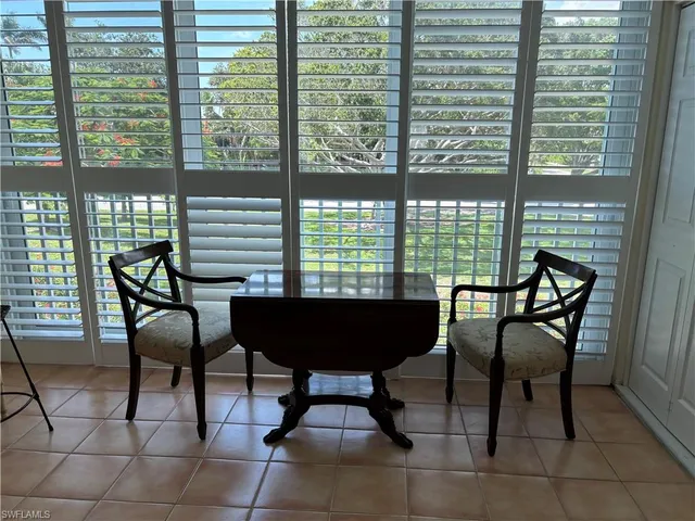 a bedroom with furniture and a wooden floor