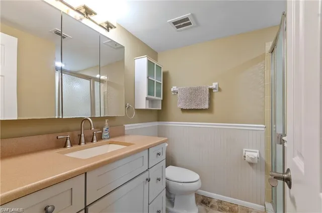 a view of a room with lounge chair and a table