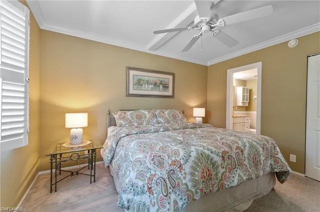 a bedroom with a bed and cupboard