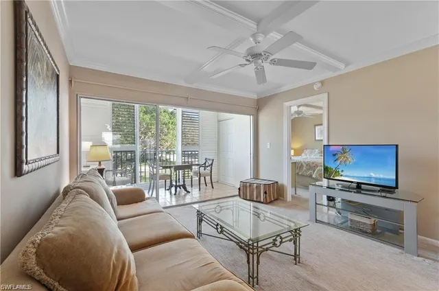 a spacious bedroom with a bed and a table in it