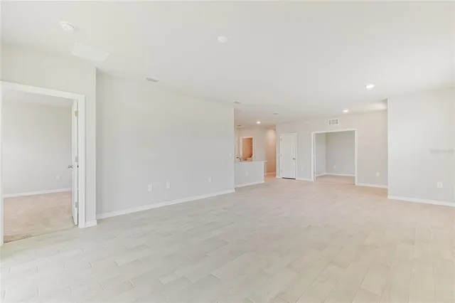 a kitchen with stainless steel appliances a refrigerator sink and microwave
