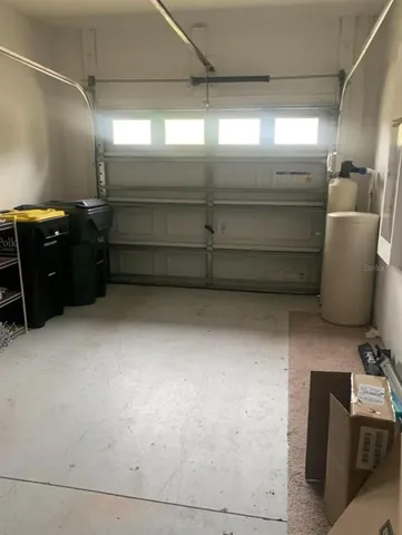 a house with potted plants in front of it