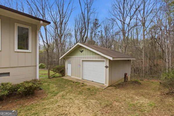 a view of a porch with wooden floor and fence