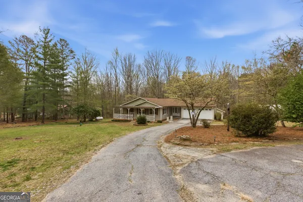 a kitchen that has a sink a stove and cabinets