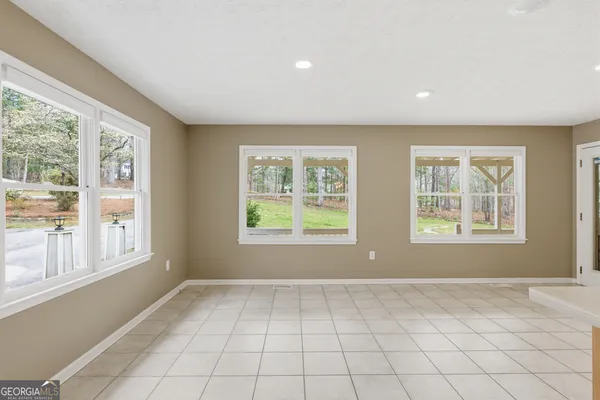 a kitchen with stainless steel appliances granite countertop a sink and a stove