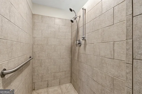 a bathroom with a tub and shower
