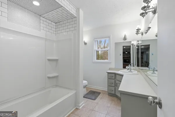 a view of a house with a wooden deck