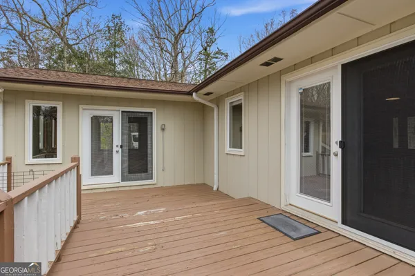 a house that has a tree in front of it