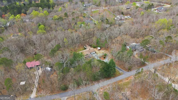 a aerial view of a house with a yard